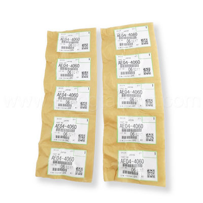 comprar O dedo da máquina desbastadora do fusor para das peças quentes da copiadora da venda do Ricoh AE044060 o dedo superior da máquina desbastadora do fusor tem de alta qualidade e estável fabricação em linha